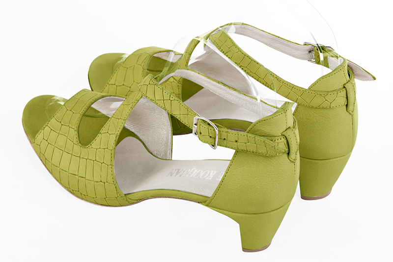 Pistachio green women's closed back sandals, with crossed straps. Round toe. Low comma heels. Rear view - Florence KOOIJMAN